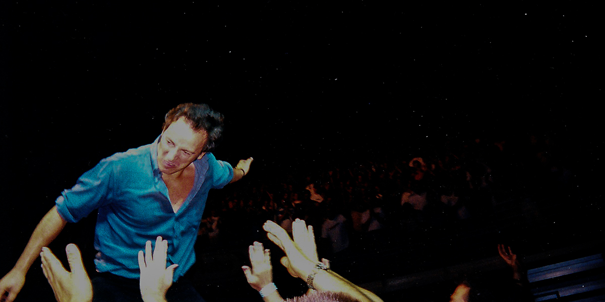 Bruce Springsteen high-fives the crowd in Salt Lake City