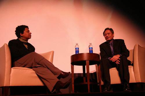 Ang Lee and Lisa Kennedy on the stage of the Ellie Caulkins Opera House