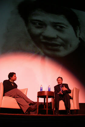 Ang Lee and Lisa Kennedy on the stage of the Ellie Caulkins Opera House