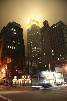 The Empire State Building by the fog of night