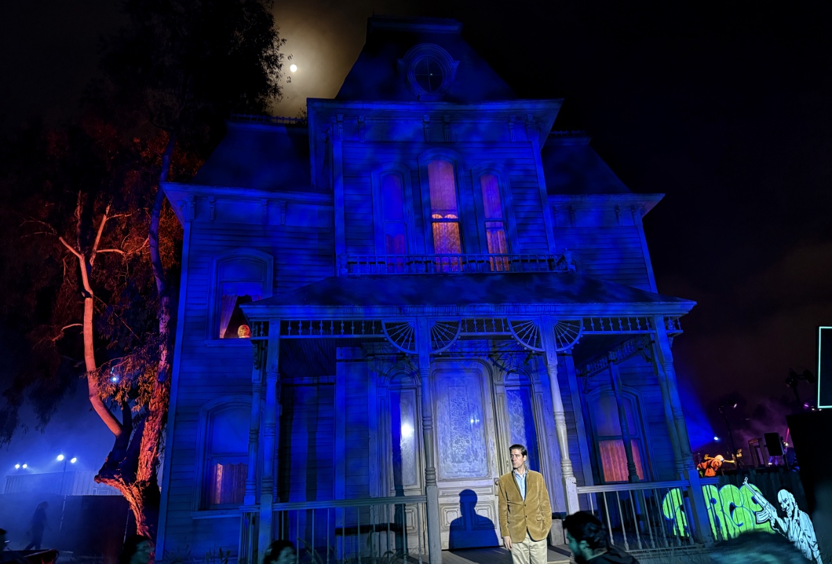 Norman Bates stands guard outside the house, bathed in the light of a full moon. Mother rocks gently in the window.