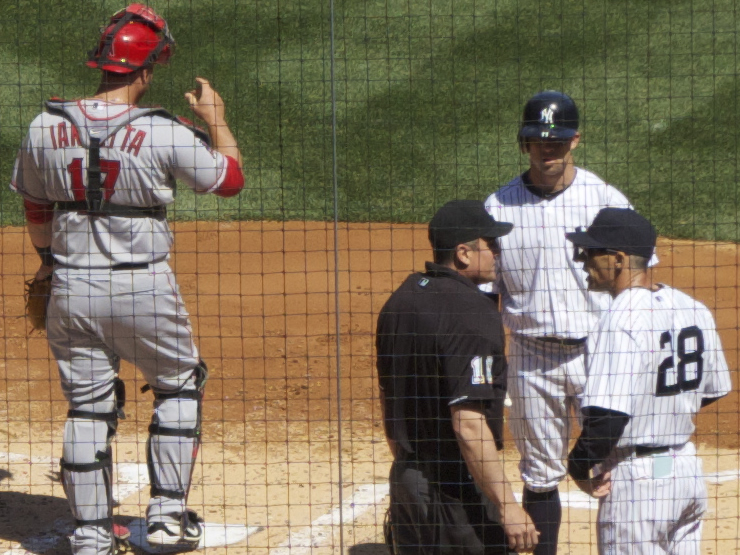 Joe Girardi (#28) makes a point with the umpire